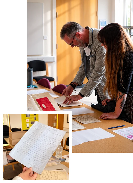 Volunteers examining historical documents from St Walburge's and architectural plans.