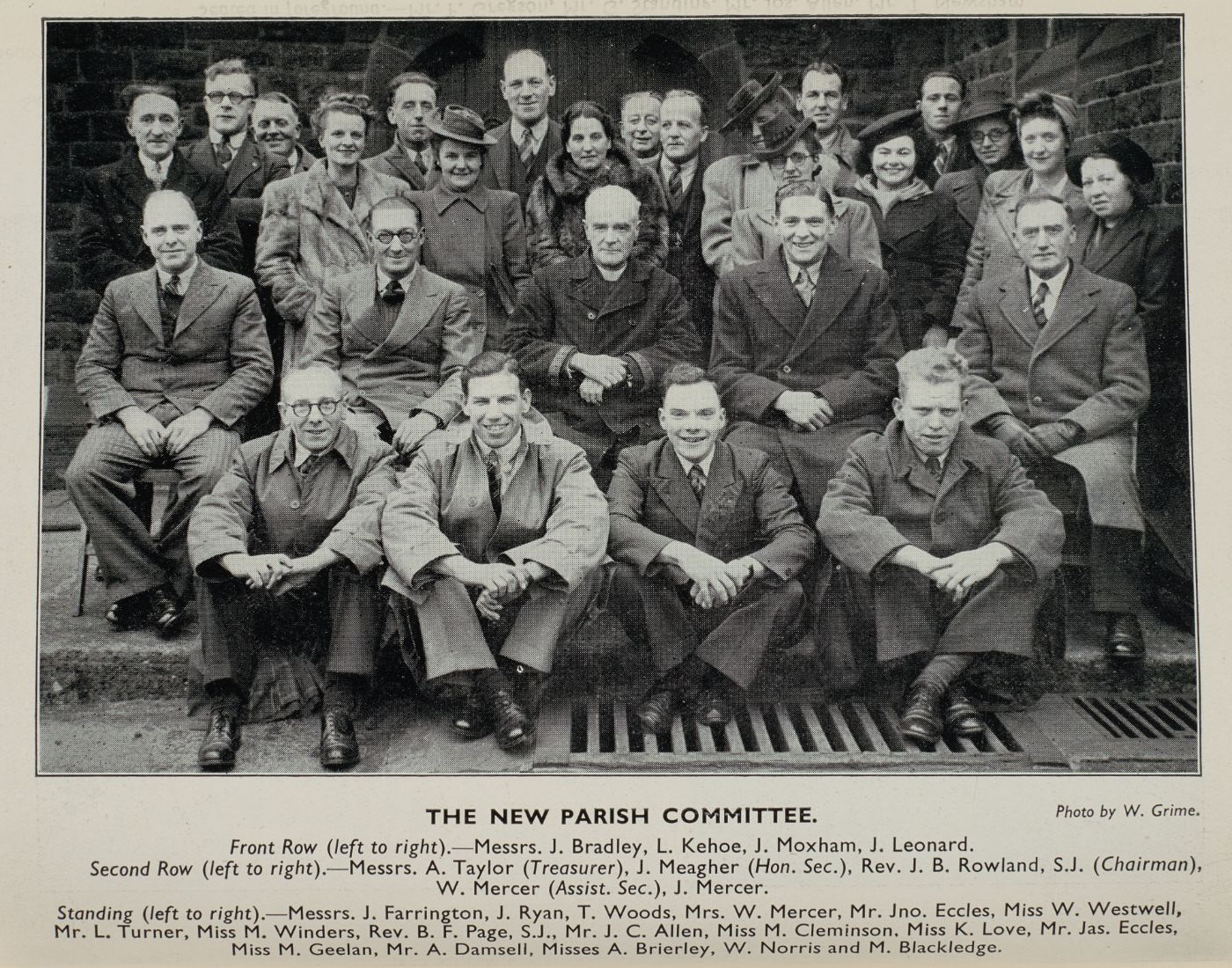 Group photograph of the new parish committee arranged in three rows outside the church, each member named in the printed caption below, photo credited to W. Grime.