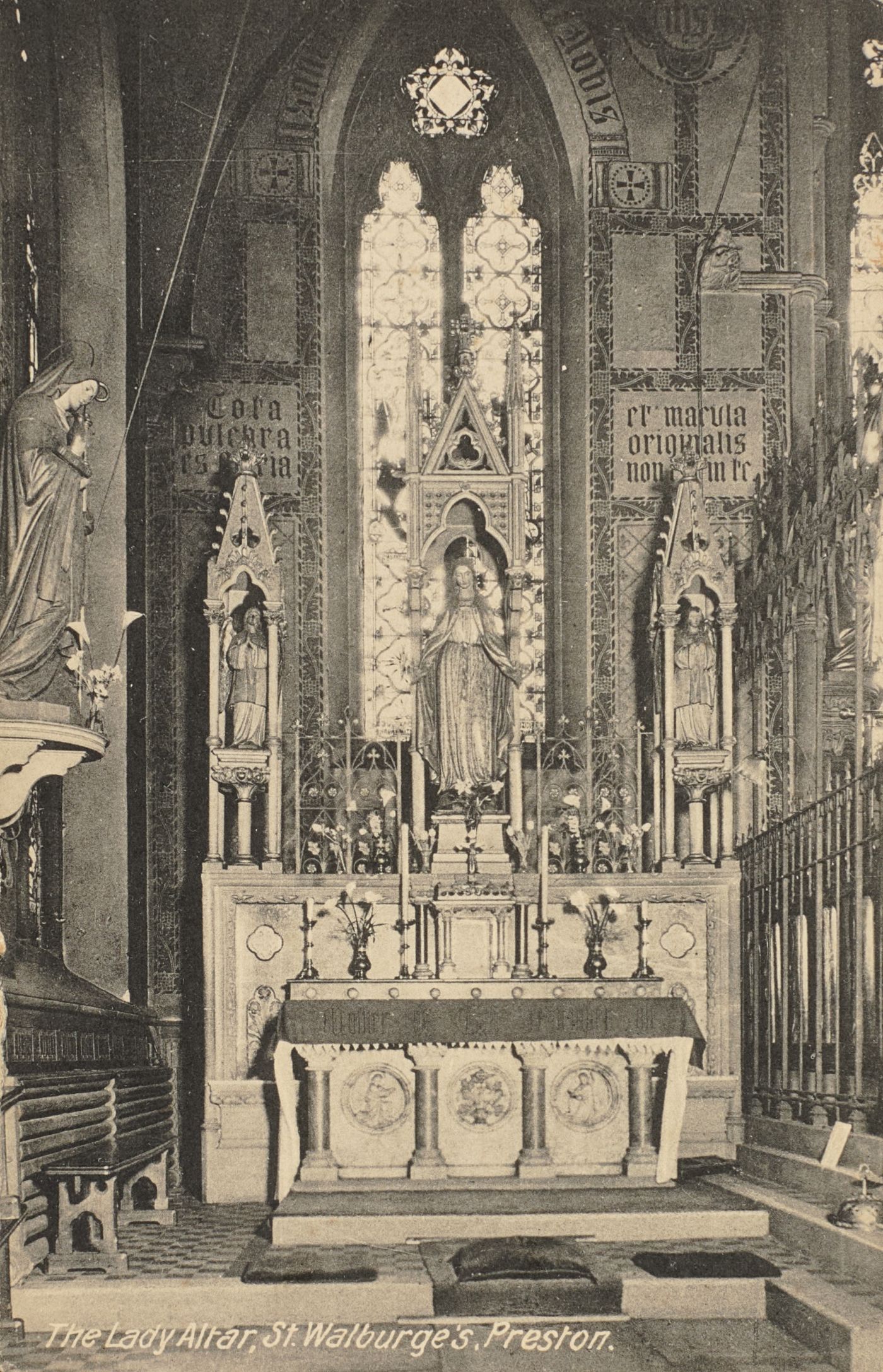 Printed postcard of the Lady Altar at St Walburge's, a statue of Our Lady flanked by saints beneath painted texts, captioned "The Lady Altar, St Walburge's, Preston."