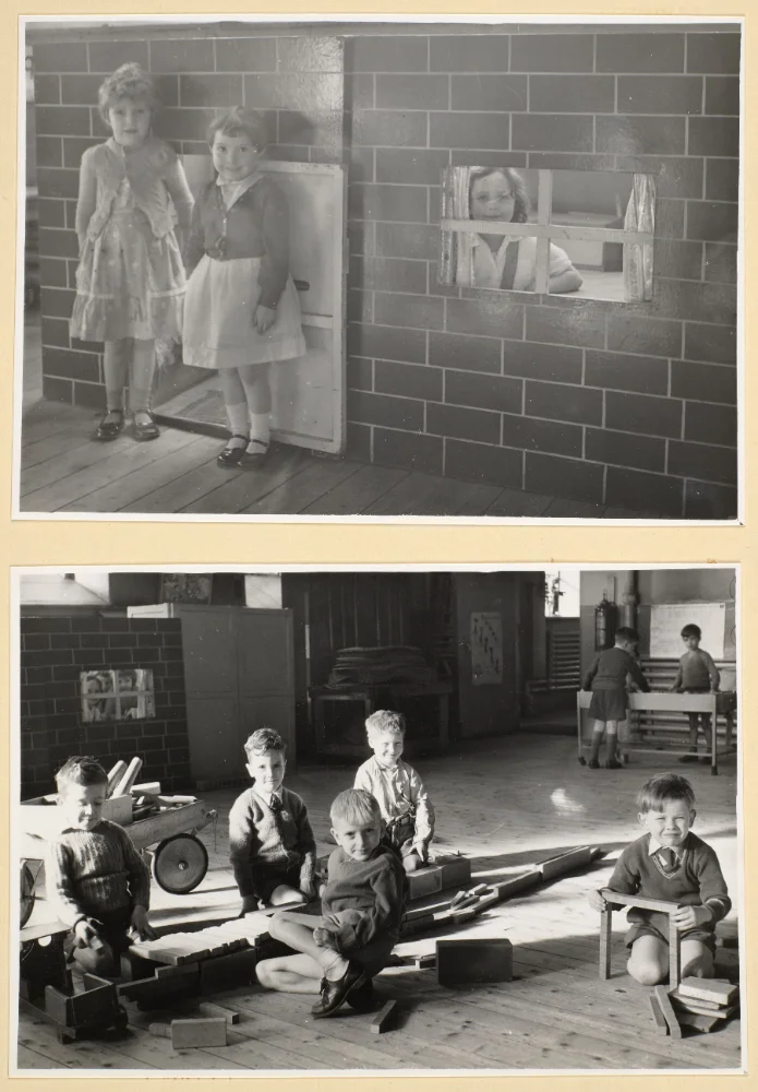 Two photographs of infant pupils at play: girls at a mock brick play house with a window hatch, and boys building with wooden blocks and a cart.