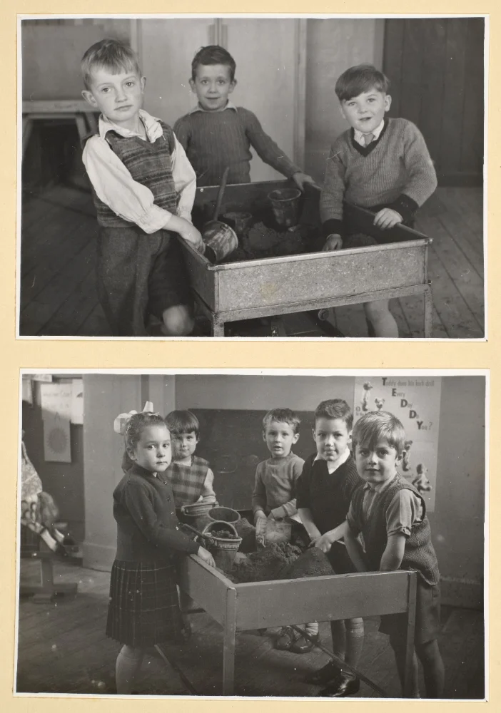 Two photographs of infant pupils gathered round a sand tray with buckets and spades, a "Teddy Bear" wall poster visible in the lower scene.