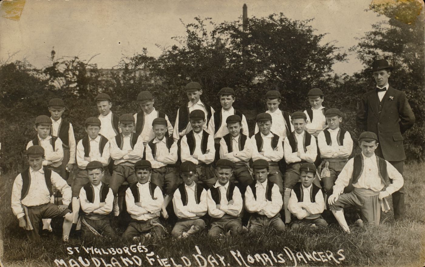 Group photograph of boys in matching Morris dancer costume, captioned "St Walburge's Maudland Field Day Morris Dancers," with a man in a suit standing at one side.
